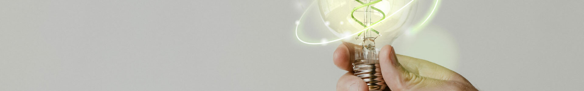 Green energy with hand holding an environmental light bulb backg Green energy with hand holding an environmental light bulb background